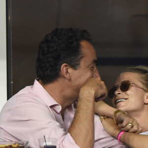Olivier Sarkozy et Mary-Kate Olsen complices lors du tournoi de l'US Open à Flushing le 1er septembre 2014.