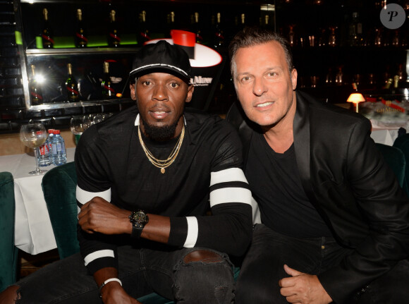 Exclusif - Le champion Usain Bolt et Jean Roch au restaurant La Gioia au VIP Room à Paris le 12 juin 2018. © Rachid Bellak / Bestimage