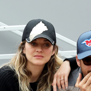 Marion Cotillard et son compagnon Guillaume Canet - People dans les tribunes lors de la finale messieurs des internationaux de France de tennis de Roland Garros 2019 à Paris le 9 juin 2019. © Jacovides-Moreau/Bestimage