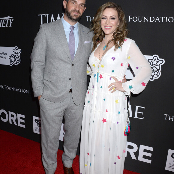 Alyssa Milano et son mari Dave Bugliari au photocall du 10ème anniversaire du gala caritatif "Core" à Los Angeles, le 15 janvier 2020.