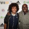 Lucien Jean-Baptiste et son fils Bilal - Photocall pour le lancement du jeu vidéo " FIFA 17" au Cercle Cadet à Paris le 26 septembre 2016. © Rachid Bellak/Bestimage