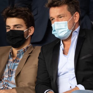 Benjamin Castaldi et son fils Simon lors du match PSG-Olympique de Marseille au Parc des princes le 13 septembre 2020. Photo by David Niviere/ABACAPRESS.COM