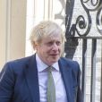 Boris Johnson quitte sa résidence tandis qu'une livraison arrive pour son nouveau-né à Londres, le 6 mai 2020.