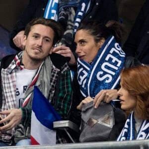 Alessandra Sublet et un ami, Maëva Coucke (Miss France 2018) - People assistent au match des éliminatoires de l'Euro 2020 entre la France et l'Islande au Stade de France à Saint-Denis. La france a remporté le match sur le score de 4-0.