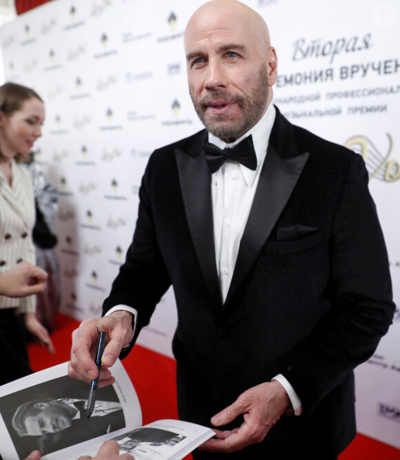 John Travolta - Photocall de la cérémonie "BraVo international classical music awards" au théâtre du Bolchoï à Moscou, le 19 mars 2019.