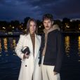 Alice Barbier et Jean-Sebastien Roques ("J'aime tout chez toi") assistent au défilé AMI, collection prêt-à-porter printemps-été 2021 sur le pont de Sully à Paris. Le 3 octobre 2020 © Olivier Borde / Bestimage