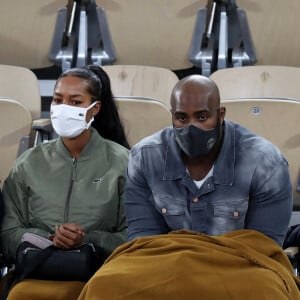 Teddy Riner et sa compagne Luthna Plocus assistent à la finale simple homme des internationaux de tennis de Roland Garros, opposant Rafael Nadal à Novak Djokovic. Paris, le 11 octobre 2020. © Dominique Jacovides / Bestimage