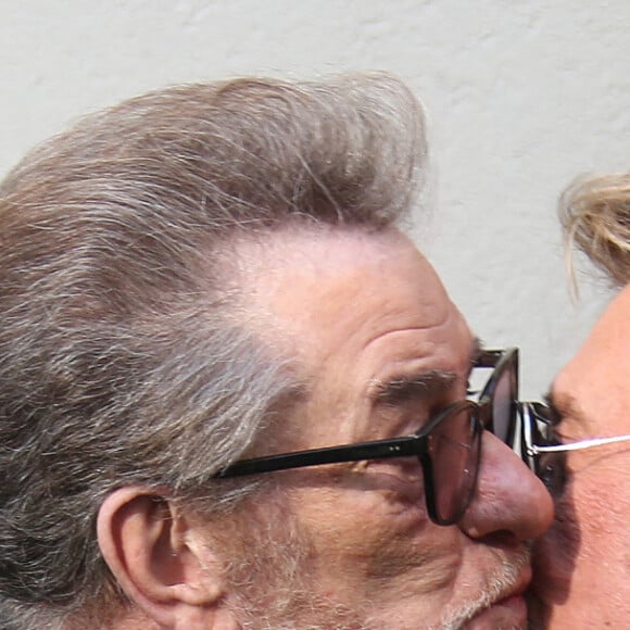 Eddy Mitchell et Johnny Hallyday - Johnny Hallyday quitte l'enregistrement de l'émission de radio au studio de RTL à Paris le 14 mars 2014.