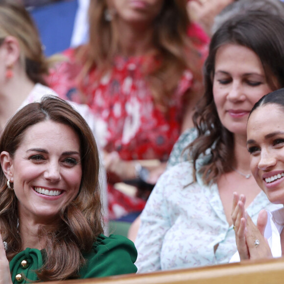 Catherine (Kate) Middleton, duchesse de Cambridge, Meghan Markle, duchesse de Sussex, et Pippa Middleton dans les tribunes lors de la finale femme de Wimbledon "Serena Williams - Simona Halep (2/6 - 2/6) à Londres, le 13 juillet 2019.