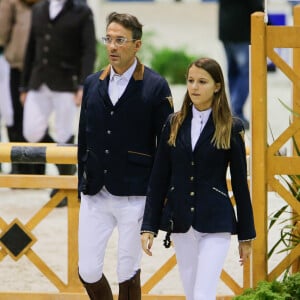 Lola Courbet, la fille de l'animateur Julien Courbet, en reconnaissance avec son père au jumping international de Bordeaux pour l'épreuve partenaire le 5 février 2016. Lola Courbet monte pour son partenaire Victory Horse. © Thibaud Moritz/Quentin Salinier/Bestimage