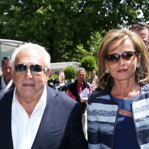 Dominique Strauss Kahn et sa compagne Myriam L'Aouffir aux Internationaux de France de tennis de Roland Garros le 30 mai 2015.