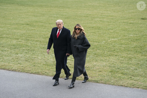 Le président Donald Trump et sa femme Melania arrivent à la Maison Blanche après leur séjour en Floride le 31 décembre 2020 
