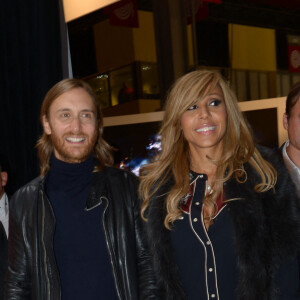 David et Cathy Guetta au salon mondial de l'automobile à Paris, le 27 décembre 2013.