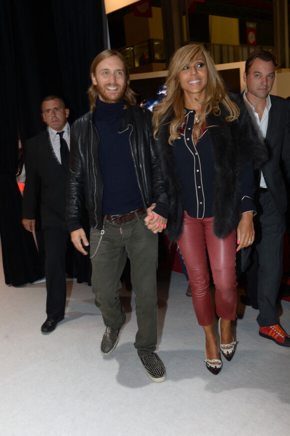 David et Cathy Guetta au salon mondial de l'automobile à Paris, le 27 décembre 2013.