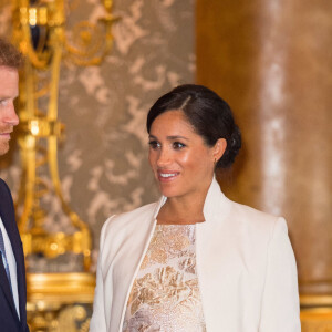 Le prince Harry, duc de Sussex, et Meghan Markle (enceinte), duchesse de Sussex - La famille royale d'Angleterre lors de la réception pour les 50 ans de l'investiture du prince de Galles au palais Buckingham à Londres. Le 5 mars 2019