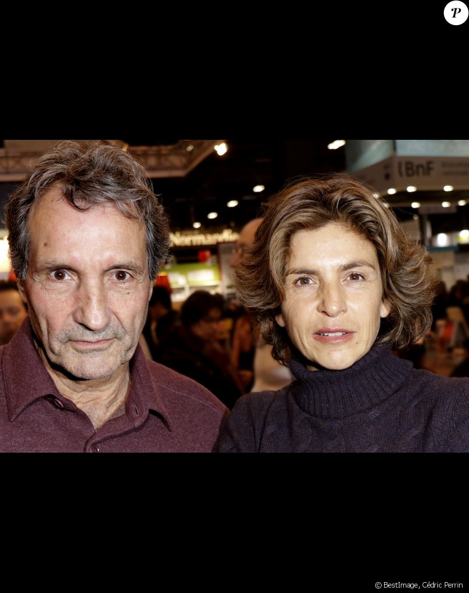Jean-Jacques Bourdin et sa femme Anne Nivat - 38ème salon du livre de Paris à la Porte de Versailles, Paris le 17 mars 2018. © Cédric Perrin/Bestimage