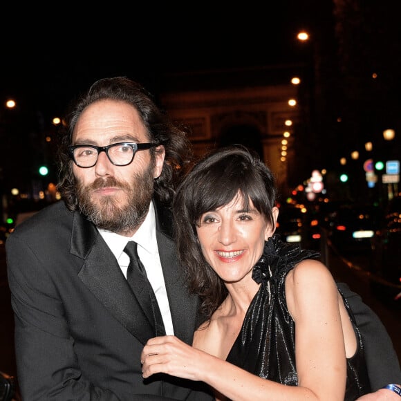 Romane Bohringer et son compagnon Philippe Rebbot - Personnalités lors de la 10ème cérémonie des Globes de Cristal au Lido à Paris, le 13 avril 2015. 