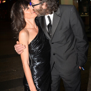 Romane Bohringer et son compagnon Philippe Rebbot - Personnalités lors de la 10ème cérémonie des Globes de Cristal au Lido à Paris, le 13 avril 2015. 