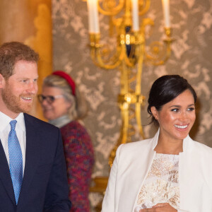 Le prince Harry, duc de Sussex, et Meghan Markle (enceinte), duchesse de Sussex - La famille royale d'Angleterre lors de la réception pour les 50 ans de l'investiture du prince de Galles au palais Buckingham à Londres. Le 5 mars 2019