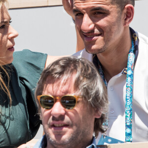 Marion Bartoli et son nouveau compagnon le joueur de football belge Yahya Boumediene dans les tribunes lors des internationaux de tennis de Roland Garros à Paris, France, le 2 juin 2019. © Jacovides-Moreau/Bestimage