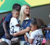 Elodie Mavuba et son fils Tiago ( Merci de flouter le visage des enfants) - Les femmes et les compagnes des joueurs de l'équipe de France assistent au match France - Nigéria à Brasilia au Brésil, le 30 juin 2014, lors de la coupe du monde de la FIFA 2014.