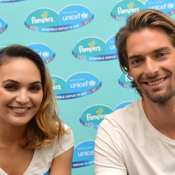 Camille Lacourt et sa femme Valérie Bègue sont les parrain et marraine du 10ème anniversaire du partenariat entre Pampers et l'Unicef pour le vaccin des enfants contre le tétanos, à Paris, le 13 novembre 2015.