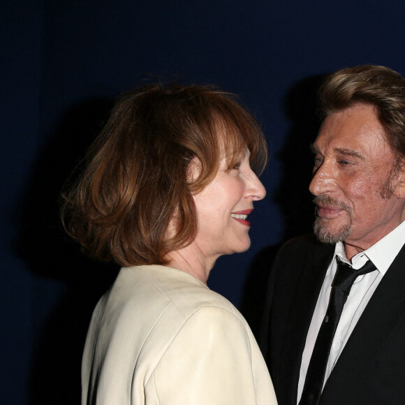 Nathalie Baye et Johnny Hallyday - Avant-première de 'Salaud on t'aime' à l'UGC Normandie sur les Champs-Elysées à Paris le 31 mars 2014.
