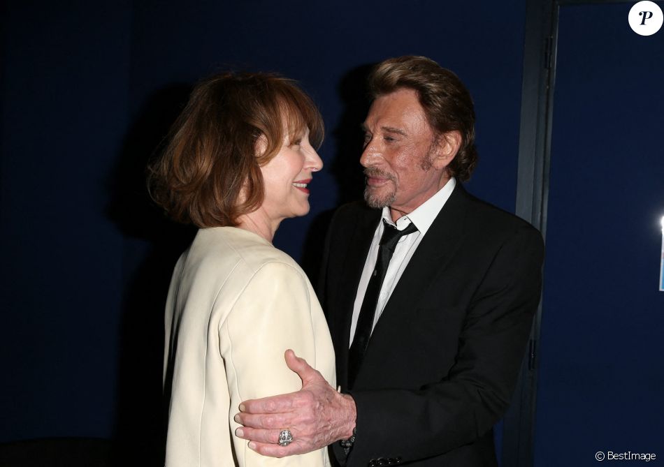 Nathalie Baye et Johnny Hallyday - Avant-première de 'Salaud on t'aime' à l'UGC Normandie sur les Champs-Elysées à Paris le 31 mars 2014.