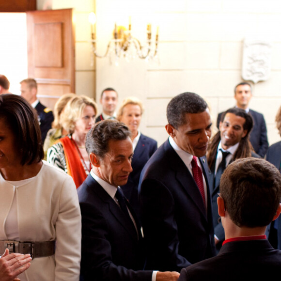 Nicolas Sarkozy et sa femme Carla Bruni Sarkozy recoivent Michelle et Barack Obama a Caen. Le 6 juin 2009