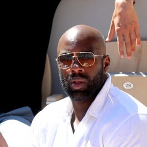 Teddy Riner et sa femme Luthna Plocus dans les tribunes lors de la finale hommes des Internationaux de France de tennis de Roland Garros à Paris le 13 juin 2021. © Dominique Jacovides / Bestimage