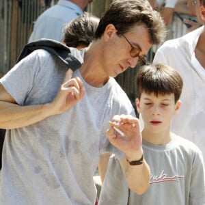 François Cluzet et son fils Paul (fils de Marie Trintignant) à ses obsèques en 2003 - Archives