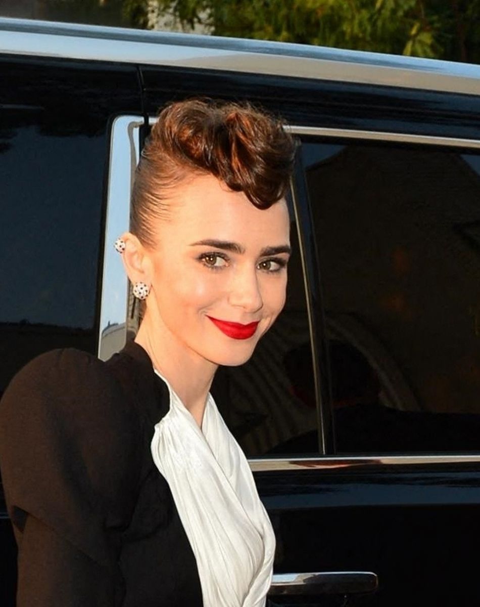 Lily Collins arrive à l'évènement "Clash" de chez Cartier à West Hollywood, Los Angeles, Californie, Etats-Unis, le 24 août 2021.
