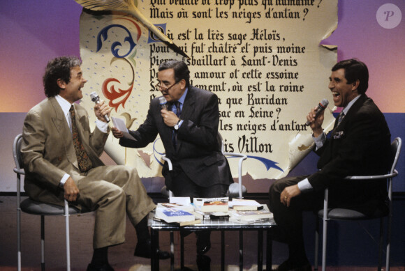 A Paris, Pierre Perret, Bernard Pivot et Jean-Pierre Foucault. Le 20 avril 1990. © Bernard Leguay via Bestimage