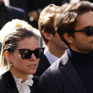 Sophie Tapie (Fille du défunt) et son mari Jean-Mathieu Marinetti - Sorties de la messe funéraire en hommage à Bernard Tapie en l'église Saint-Germain-des-Prés à Paris. Le 6 octobre 2021 © Jacovides-Moreau / Bestimage