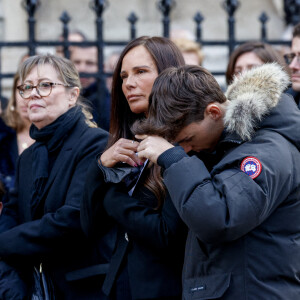 Nathalie Marquay et son fils Tom - La famille de Jean-Pierre Pernaut à la sortie des obsèques en la Basilique Sainte-Clotilde à Paris le 9 mars 2022. © Cyril Moreau/Bestimage
