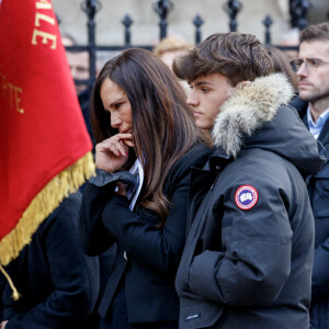 Nathalie Marquay et son fils Tom - La famille de Jean-Pierre Pernaut à la sortie des obsèques en la Basilique Sainte-Clotilde à Paris le 9 mars 2022. © Cyril Moreau/Bestimage
