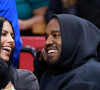 Kanye West et Chaney Jones assistent au match de NBA qui oppose les Miami Heat aux Minnesota Timberwolves, àa FTX Arena. Miami, le 13 mars 2022.