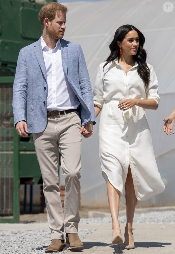 Le prince Harry, duc de Sussex, Meghan Markle, duchesse de Sussex en visite dans un township de Johannesburg le 2 octobre 2019.