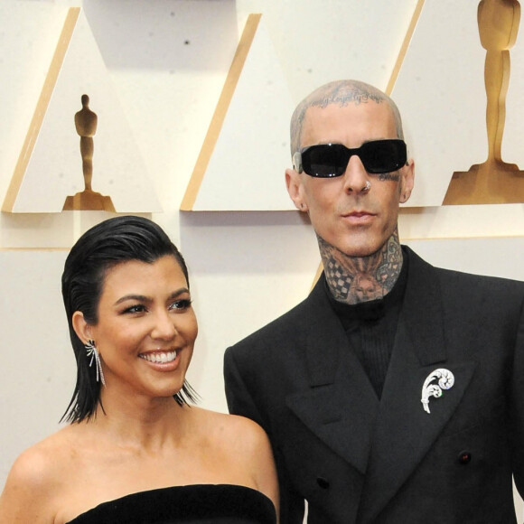 Kourtney Kardashian, Travis Barker au photocall de la 94ème édition de la cérémonie des Oscars à Los Angeles, le 27 mars 2022. 