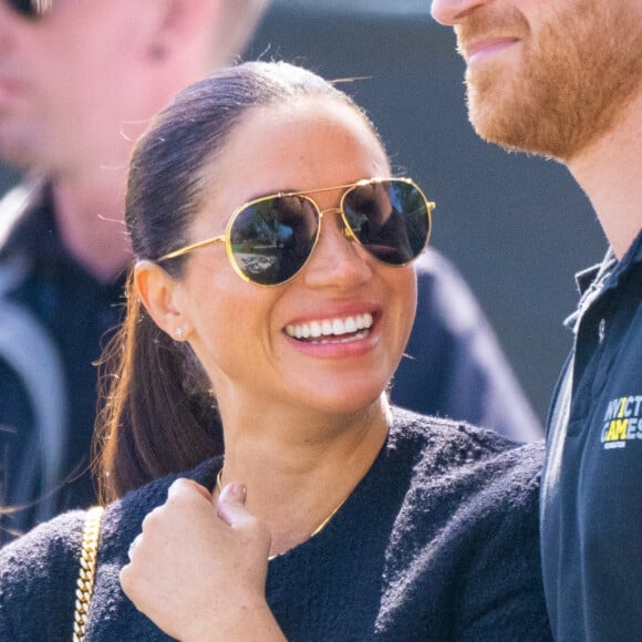 Le prince Harry et Meghan Markle lors du "Land Rover Challenge" au premier jour des Invictus Games 2020 à La Haye, le 16 avril 2022. 