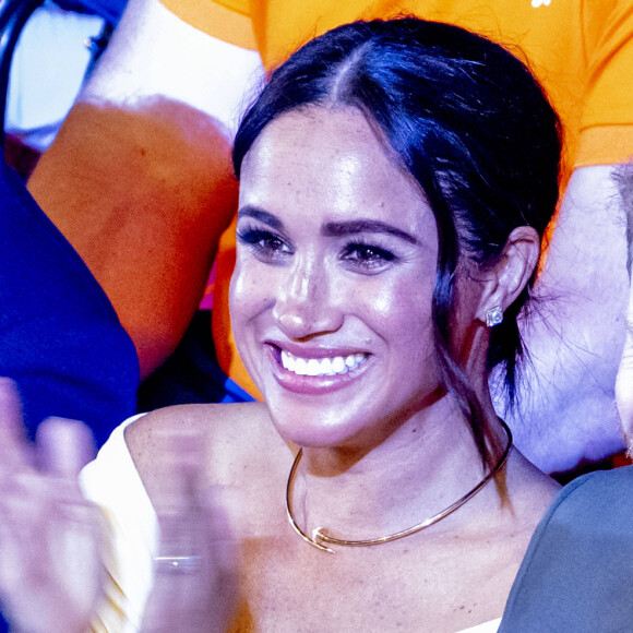 Le prince Harry et Meghan Markle lors de la cérémonie d'ouverture des Invictus Games 2020 à La Haye, le 16 avril 2022. 