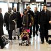 Mike Tyson à l'aéroport de Fiumicino en compagnie de sa femme Lakiha et de sa fille Milan, le 24 janvier 2010