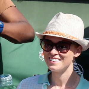 Audrey Fleurot et son nouveau compagnon Djibril Glissant assistent à la finale dame lors des Internationaux de France de tennis de Roland-Garros à Paris, le 7 juin 2014.