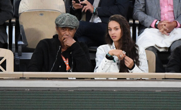 Yannick Noah et sa fille Jenaye Noah - Célébrités dans les tribunes des internationaux de France de Roland Garros à Paris le 30 mai 2022.