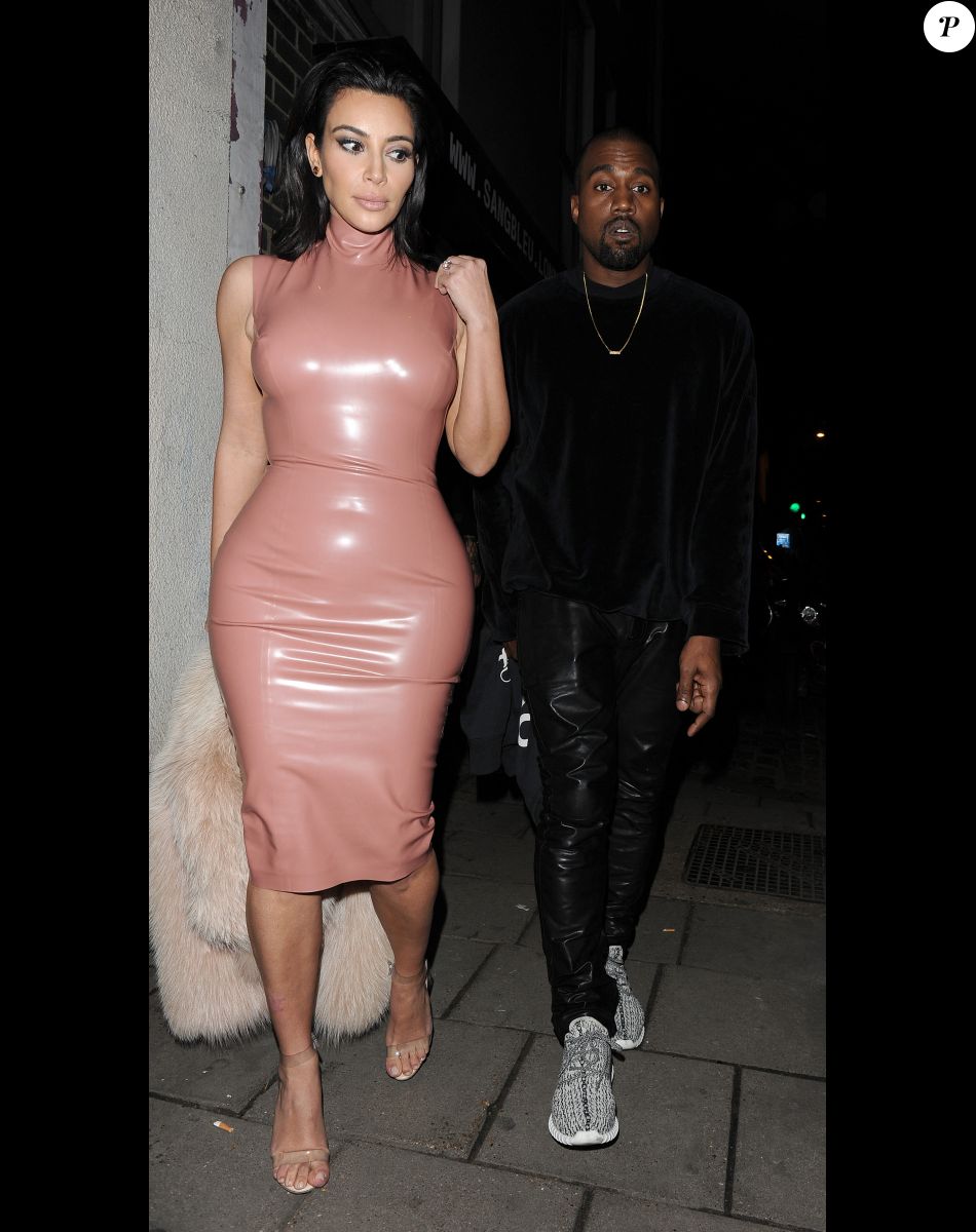 Kim Kardashian and husband Kanye West visit tattoo artist Sang Bleu Tattoo in London's Hackney district on February 25, 2015.
