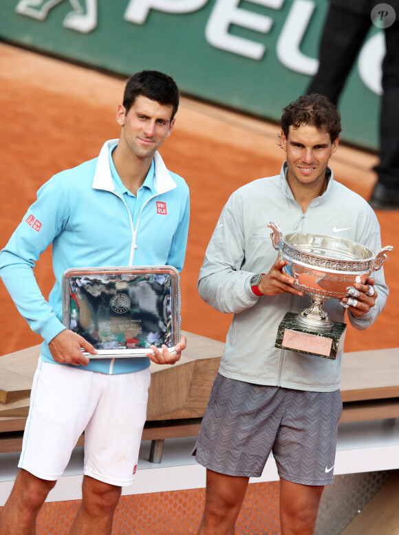 Novak Djokovic et Rafael Nadal - Rafael Nadal remporte la finale des Internationaux de France de tennis de Roland Garros à Paris le 8 juin 2014.