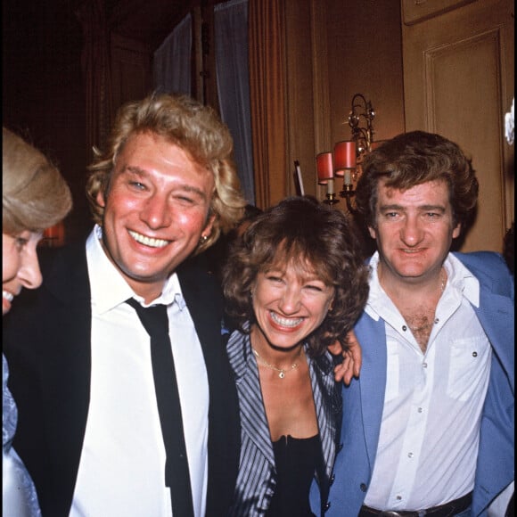 Johnny Hallyday, Nathalie Baye et Eddy Mitchell.
