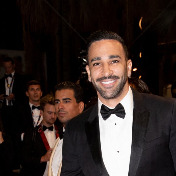 Adil Rami - Montée des marches du film "Novembre" lors du 75ème Festival International du Film de Cannes, le 22 mai 2022. © Cyril Moreau / Bestimage 