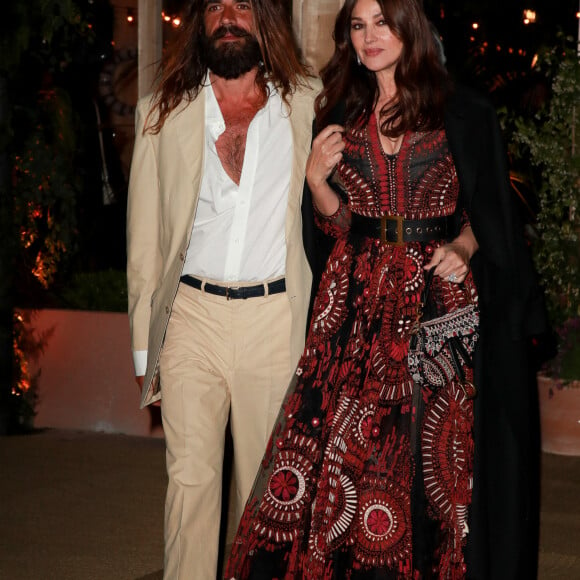 Monica Bellucci (habillée en Dior) et Nicolas Lefebvre à la sortie de la soirée "Dior Vogue" chez "Fred l'écailler" lors du 72ème Festival International du Film de Cannes, le 15 mai 2019.