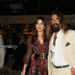 Monica Bellucci (habillée en Dior) et Nicolas Lefebvre à la sortie de la soirée "Dior Vogue" chez "Fred l'écailler" lors du 72ème Festival International du Film de Cannes, le 15 mai 2019.